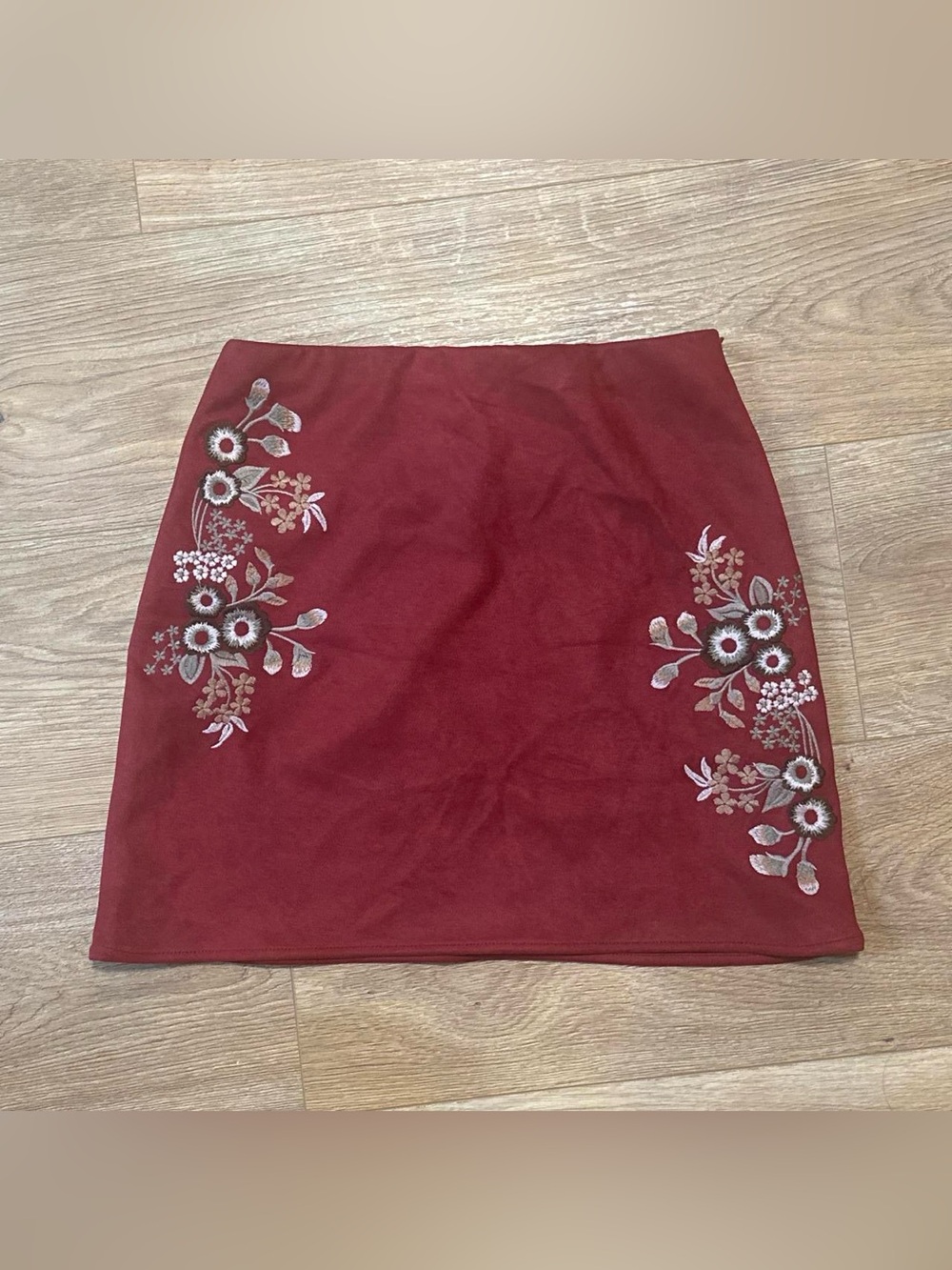 suede red skirt with floral embroidery